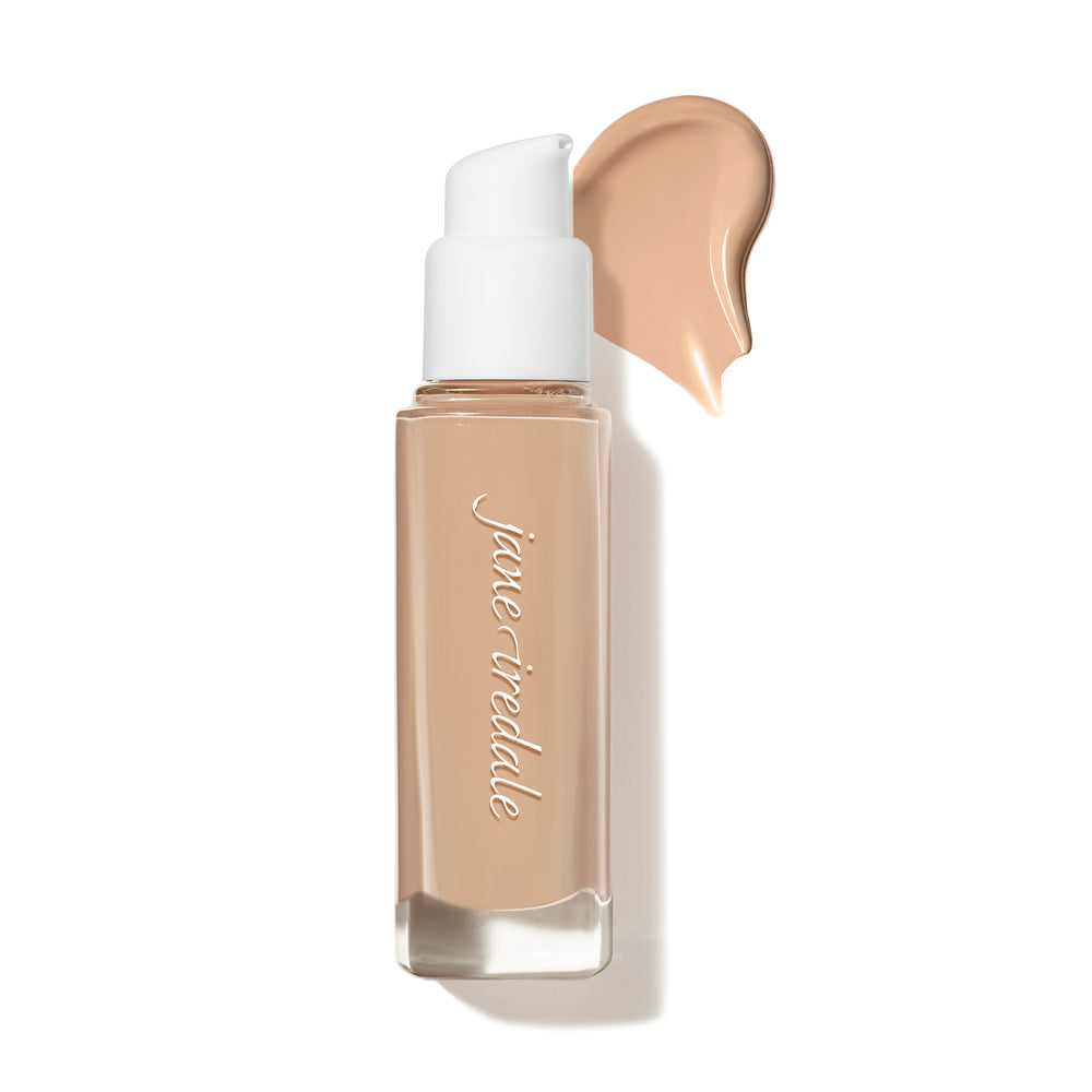 Ein Bild der Glasflasche der jane iredale Flüssigfoundation Skintuition mit einer Abbildung des Farbtons als Farbtupfer